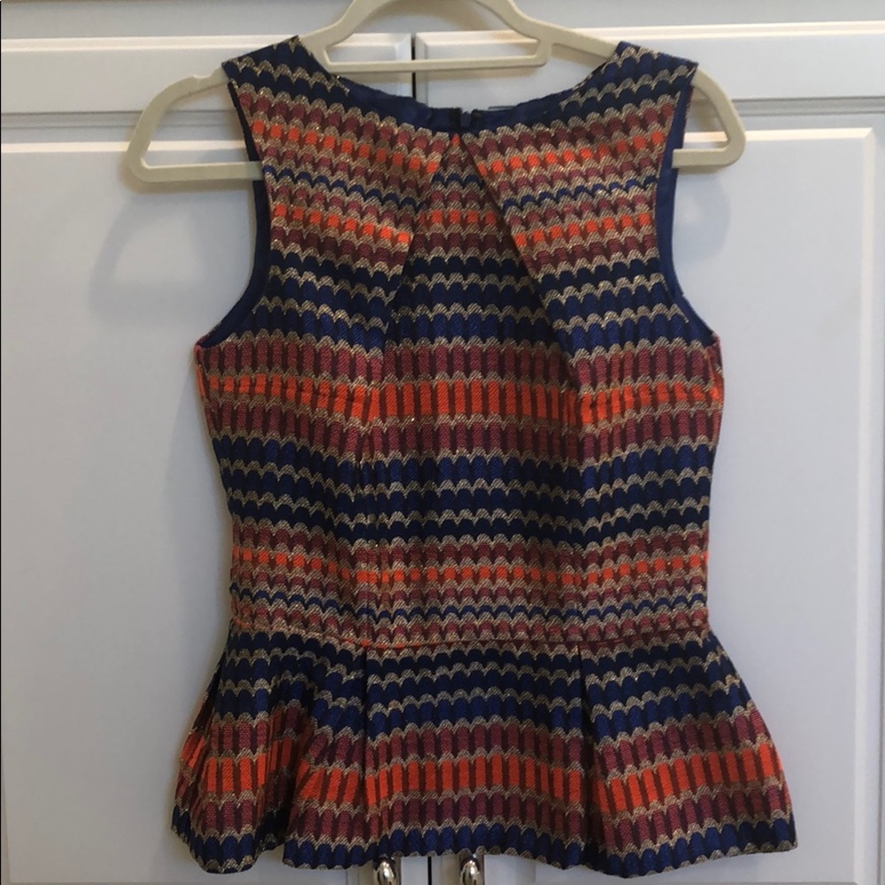 Fabulous Brit Ryan peplum tip